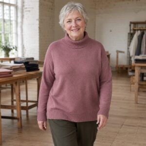 Kelmscott Roll Neck Jumper — Jumpers by WOOL BARN. worn by a model.