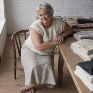 Ashcombe Cable Knit Vest — Knitted Vests by WOOL BARN. worn by a model.